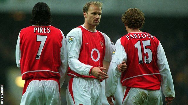 Robert Pires, Dennis Bergkamp and Ray Parlour line up to form a wall during a match for Arsenal