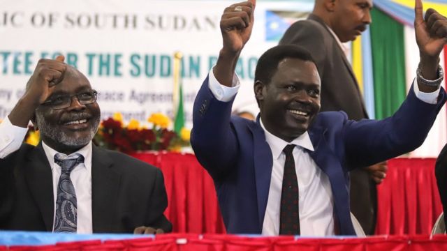 L-R: Gibril Ibrahim Mohammed, leader of Sudan's Justice and Equality Movement (Jem) and Minni Minnawi of Sudan Liberation Movement/Army (SLM/A) gesture after the signing of the peace agreement - 31 August 2020