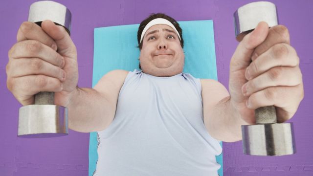 Man lifting small weights
