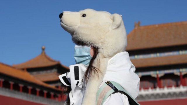 On January 6, a tourist wearing a bear-shaped hat visited the Forbidden City in Beijing.