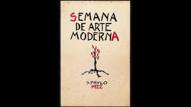 Fotografia da capa do programa da Semana de Arte Moderna de 22, com ilustração de uma árvore com ramos vermelhos feita por Di Cavalcanti