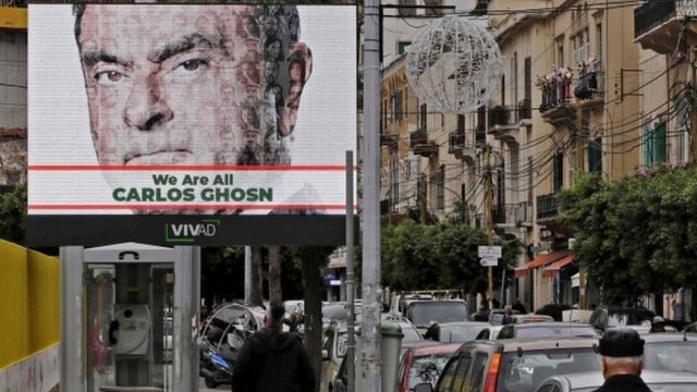 Image shows a portrait of Carlos Ghosn on a publicity billboard in his support on a street in Beirut