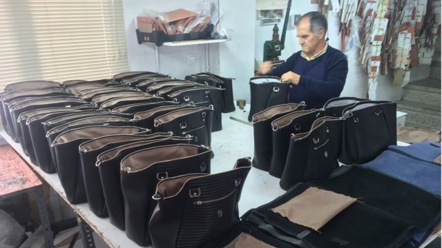 Louis Vuitton: Luxury handbags coming off an assembly line
