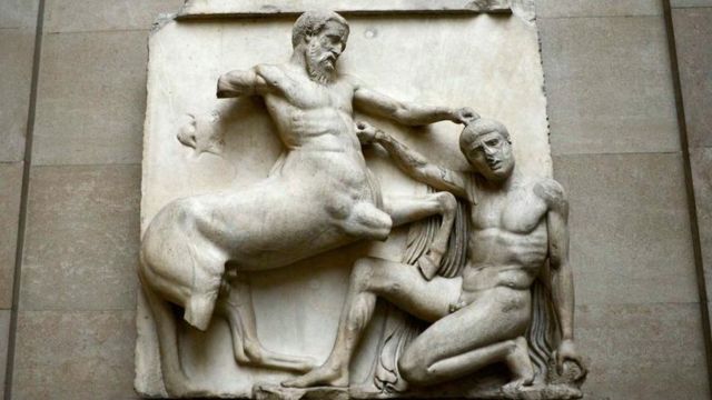 A sculpture of a centaur in combat with a man, part of the Parthenon Sculptures, on display in the British Museum.