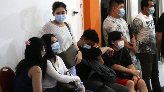 Relatives of passengers on the Sriwijaya Air plane await news at Pontianak Airport, Indonesia, January 9, 2021