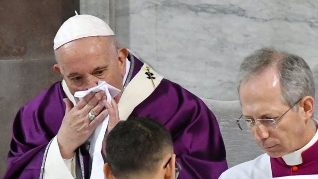 Pope Francis wipes his nose during the Ash Wednesday mass which opens Lent