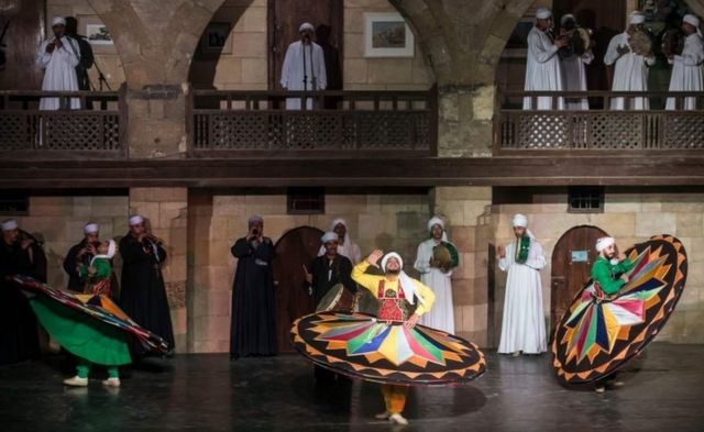 Egyptian dancers perform the Tanoura during the holy fasting month of Ramadan, at el-Ghuri culture Palace in Cairo on May 22, 2018.