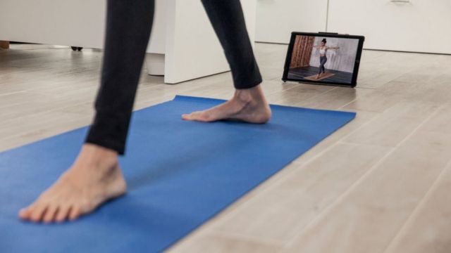 Yogi using a mat to do a workout