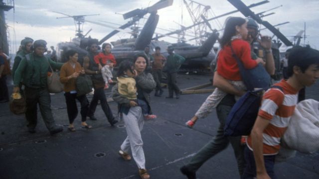 South Vietnamese refugees board a U.S. war ship April 1975 in the South China Sea near Saigon. American involvement in the Vietnam War came to an end