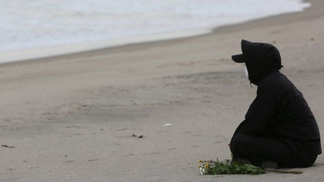 Person sat on the beach in Japan