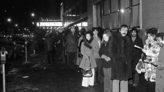 People wait in front of theaters showing The Exorcist