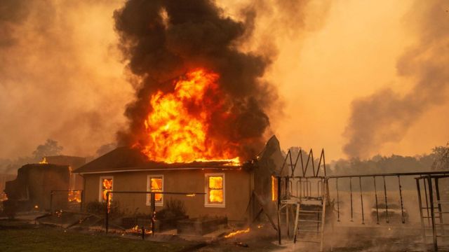 A home burns at a vineyard during the Kincade fire near Geyserville, California