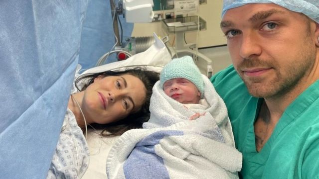 Lewis is in the hospital with her partner Dale who is carrying a newborn Ray