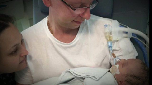 Baby Kristian Jaworski with his mother(l) and father