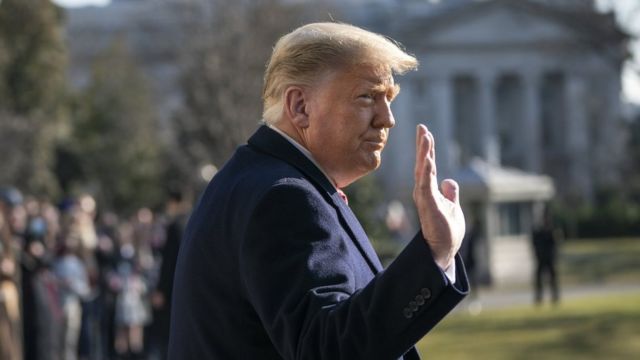 President Donald Trump waves as he walks to Marine One on the South Lawn of the White House on 12 January