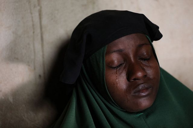 Aminah Labaran (pseudonym) cries at her home in Jangebe, Zamfara State, northwest Nigeria, on February 27, 2021, a day after her two daughters were abducted.