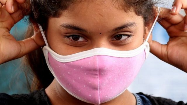 A girl wears a mask in Bangalore, India. Photo: 16 September 2020