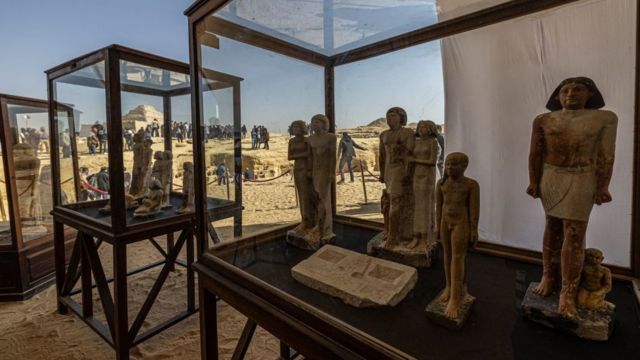 Several statues were found in tombs at an archaeological site south of Cairo.