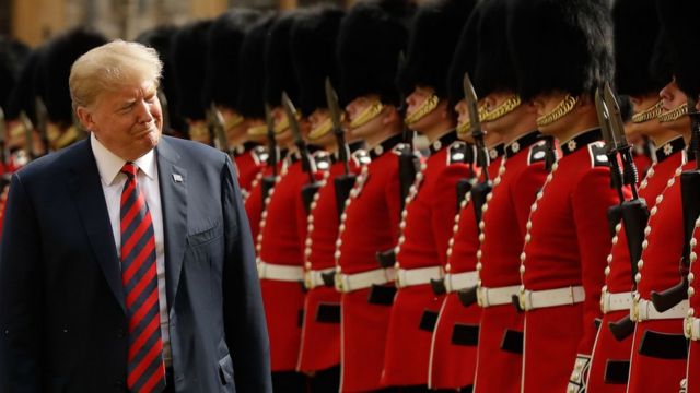 US President Donald Trump inspects the guard of honour formed of the Coldstream Guards during a welcome ceremony at Windsor Castle in Windsor, west of London