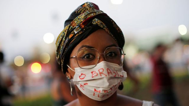 Brazilian woman in a face mask at demonstration - 23 August 2019