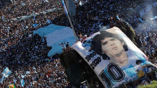 General view as Argentina fans with a Diego Maradona banner celebrate after winning the World Cup by the Obelisco REUTERS/Agustin Marcarian