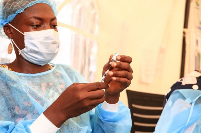 A nurse prepares a Covid vaccine