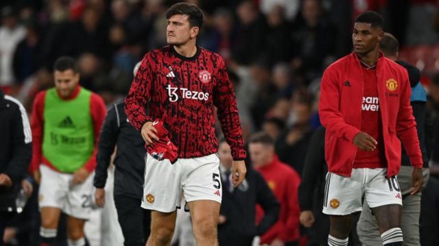 Harry Maguire walking along the touchline at Old Trafford