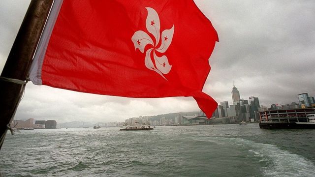 The new red flag of the Special Administrative Region (SAR) flies over Hong Kong