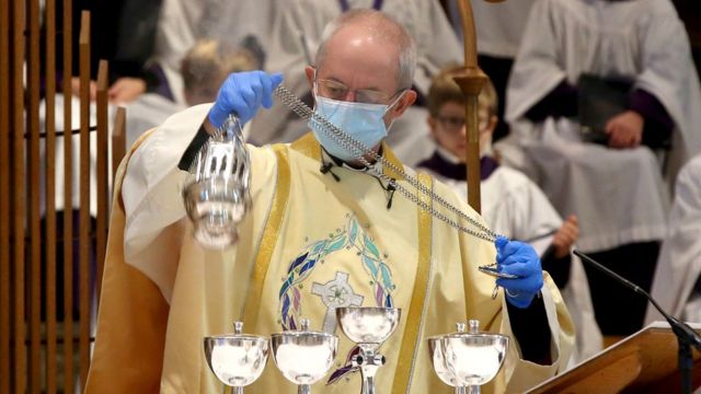 The Archbishop of Canterbury Justin Welby, wearing a protective face mask and gloves, during the Christmas Day service at Canterbury Cathedral in Kent.