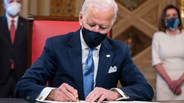 US President Joe Biden signs three documents after being sworn-in