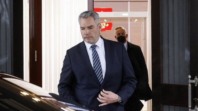 Image shows Austrian Chancellor Karl Nehammer getting into car