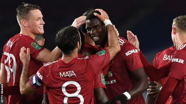 Paul Pogba (centre) congratulated by team-mates after scoring at Brighton