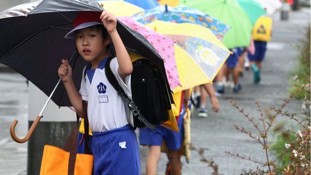 Students leave school early for protection from the approaching Typhoon on September 2, 2011 in Himeji, Japan