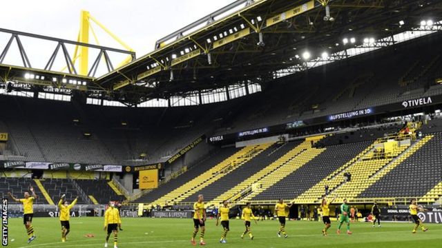 Borussia Dortmund players ran over to celebrate in front of the empty South Bank