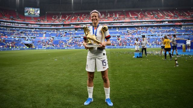 United States' forward Megan Rapinoe poses with the trophies after the France 2019 Womens World Cup football final match between USA and the Netherlands, on July 7, 2019, at the Lyon Stadium in Lyon, central-eastern France.
