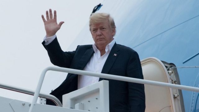 US President Donald Trump disembarks from Air Force One upon arrival at Joint Base Andrews in Maryland on 13 June 2018