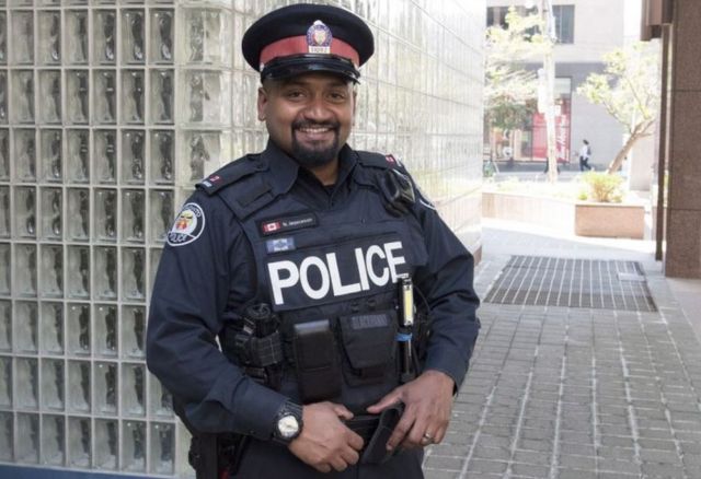 Toronto police Constable Niran Jeyanesan, who bought a teenager a shirt and tie he tried to steal for a job interview