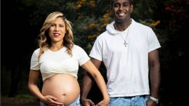 African American man wit im pregnant wife