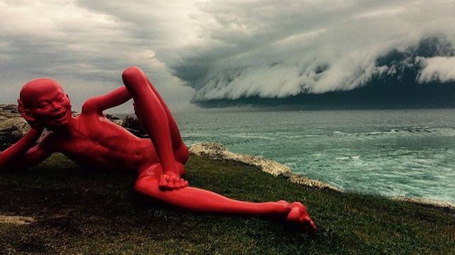 Massive cloud behind sculpture