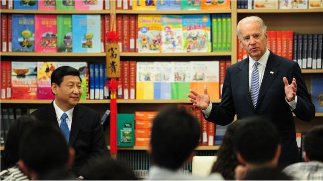 US Vice President Joe Biden (R) speaks to students as his visiting Chinese counterpart Xi Jinping (L) listens during a visit to the International Studies Learning School in Southgate, outside of Los Angeles, on February 17, 2012 in California