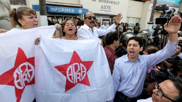 Supporters of the Peruvian ex-president Alan Garcia gather outside the Casimiro Ulloa Emergency Hospital in Lima. 17 April 2019