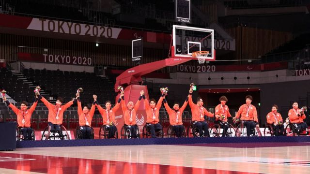 Tokyo 2020 Paralympic Games - Wheelchair Basketball - Men's Medal Ceremony - Ariake Arena, Tokyo, Japan - September 5, 2021. Japan celebrate winning silver on the podium REUTERS/Bernadett Szabo