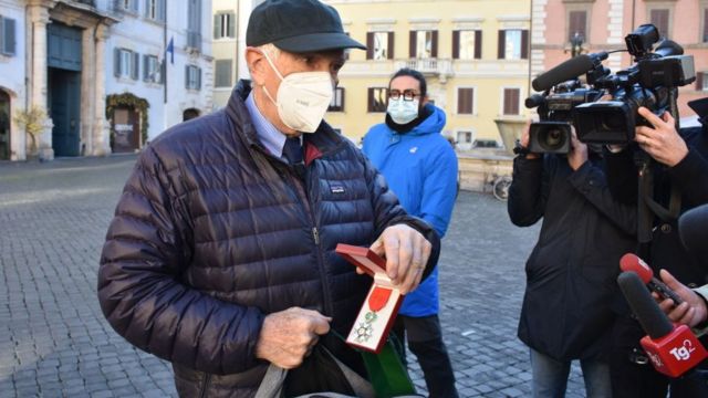 Cordo before entering the French embassy in Rome to return the medal