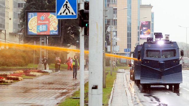 Police use a water-cannon truck during a rally to protest against the Belarus presidential election results in Minsk