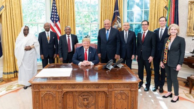 Trump in his office, among representatives of the three countries