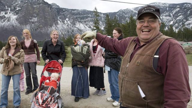 Winston Blackmore the religious leader of the polygamous community of Bountiful, B.C. shares a laugh with six of his daughters and some of his grandchildren, in this April 21, 2008 photo.