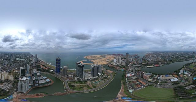 Panoramic view of Colombo, with sand reclaimed for the port city in the distance.
