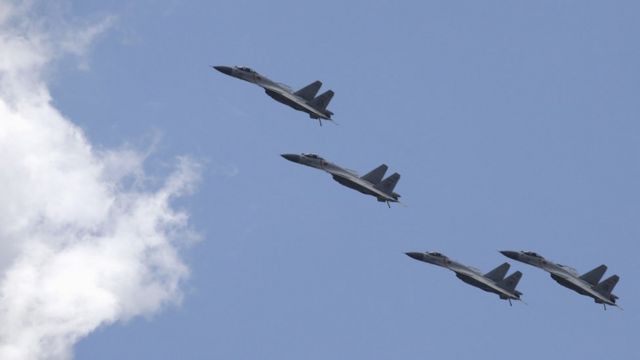 J-11B fighter jets of the Chinese Air Force fly in formation during a training session for the upcoming parade marking the 70th anniversary of the end of World War Two, on the outskirts of Beijing on 2 July 2015.
