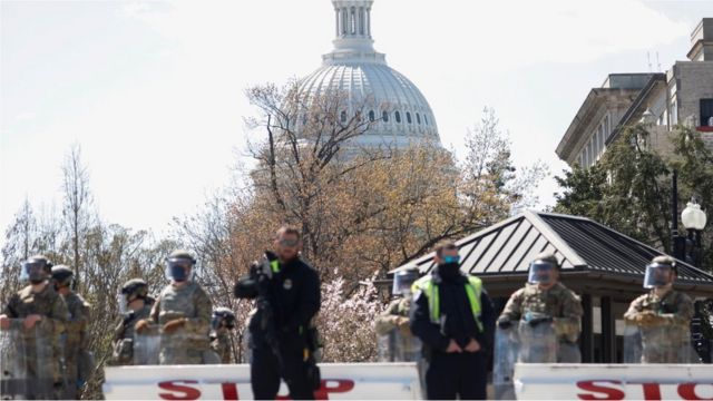 Members of the National Guard stand along a perimeter near the Supreme Court, following a security threat at the U.S. Capitol, in Washington, U.S., April 2, 2021.