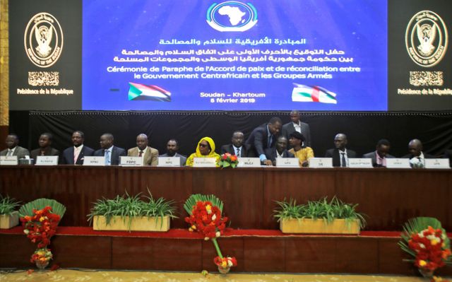 Central African armed groups leaders attend the inking of a peace deal in Khartoum on February 05, 2019. - The government of the Central African Republic and 14 armed groups on February 05 inked a new peace accord seeking to end years-long fighting that has left thousands of people dead. The accord was initialled by President Touadera for the CAR government and representatives of militias which control most of the chronically-troubled country.